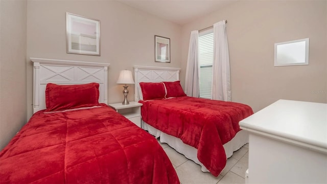 bedroom with light tile patterned floors