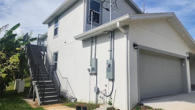 view of side of property featuring a garage