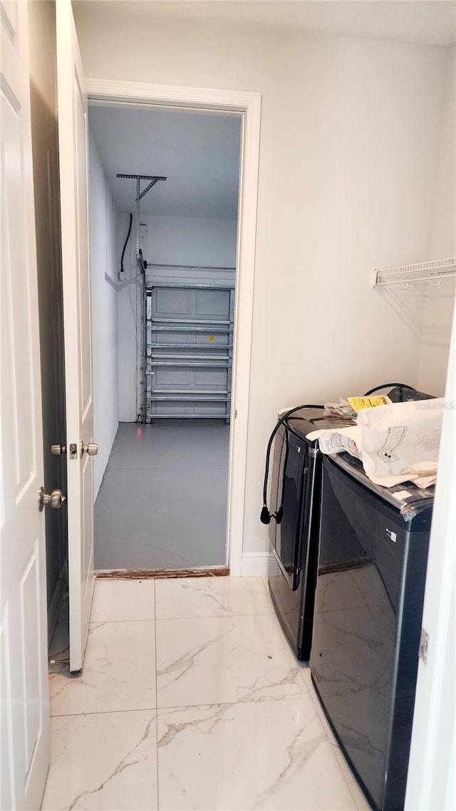 laundry room with washer and dryer