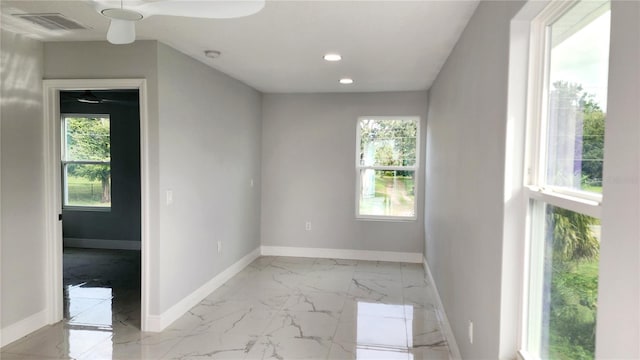 unfurnished room with ceiling fan