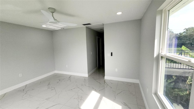 spare room with ceiling fan