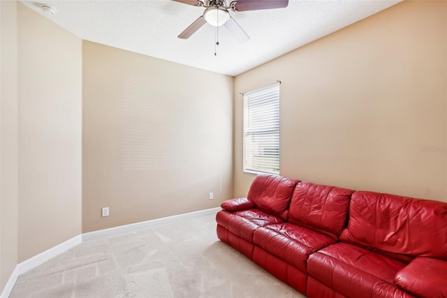 living room with light carpet and ceiling fan