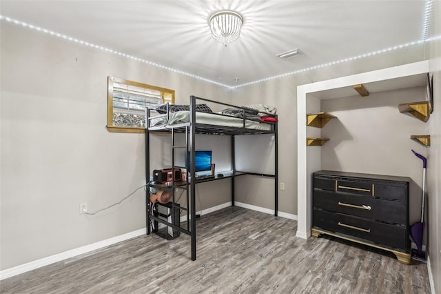 bedroom featuring hardwood / wood-style floors