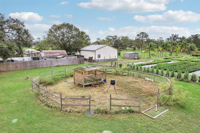 view of yard with a rural view