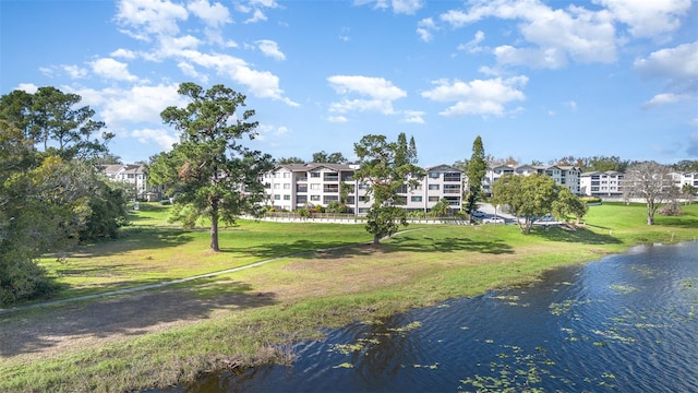 exterior space featuring a yard and a water view