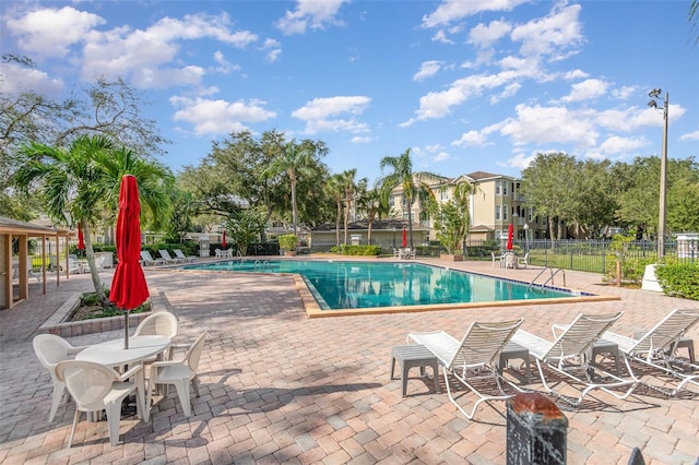 view of swimming pool featuring a patio area