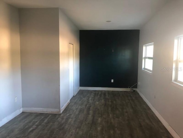 spare room featuring dark hardwood / wood-style floors