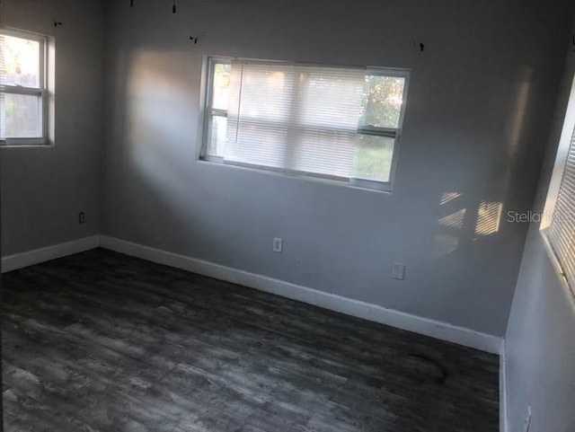 5900 Judy Dee Dr, Orlando, FL 32808 - spare room with baseboards, dark wood-style flooring, and plenty of natural light