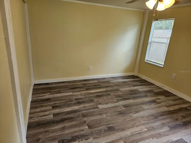 empty room with dark hardwood / wood-style floors, ceiling fan, and ornamental molding