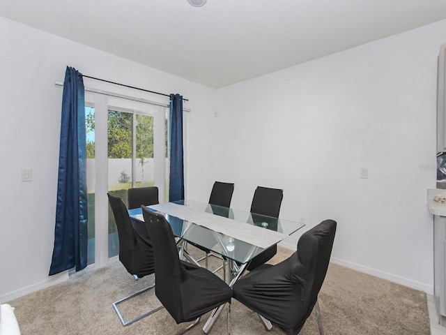 view of carpeted dining space