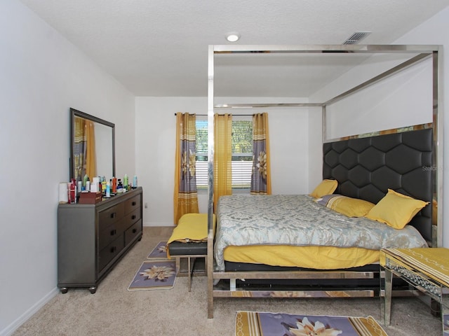 bedroom with light colored carpet