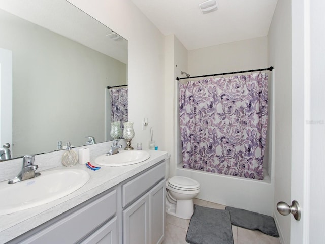 full bathroom with shower / tub combo, vanity, tile patterned floors, and toilet