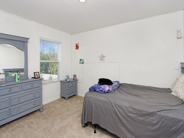 bedroom with light carpet