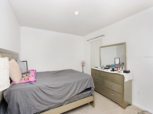 bedroom with light colored carpet