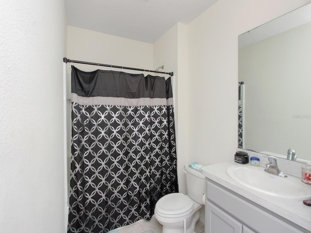 bathroom featuring vanity, a textured ceiling, curtained shower, tile patterned floors, and toilet