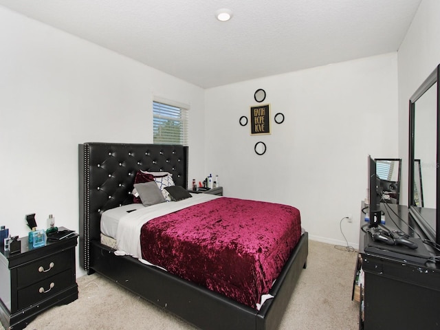 bedroom featuring light colored carpet