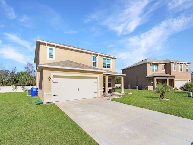 view of front of home with a garage and a front yard