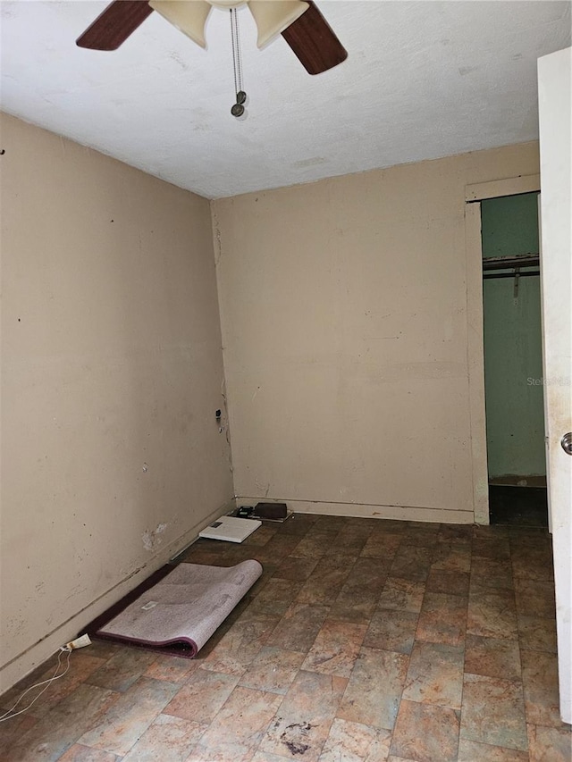 unfurnished room featuring a ceiling fan