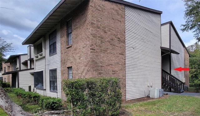 view of side of home featuring cooling unit