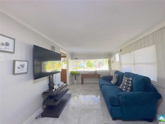 living room featuring ornamental molding and light tile patterned flooring