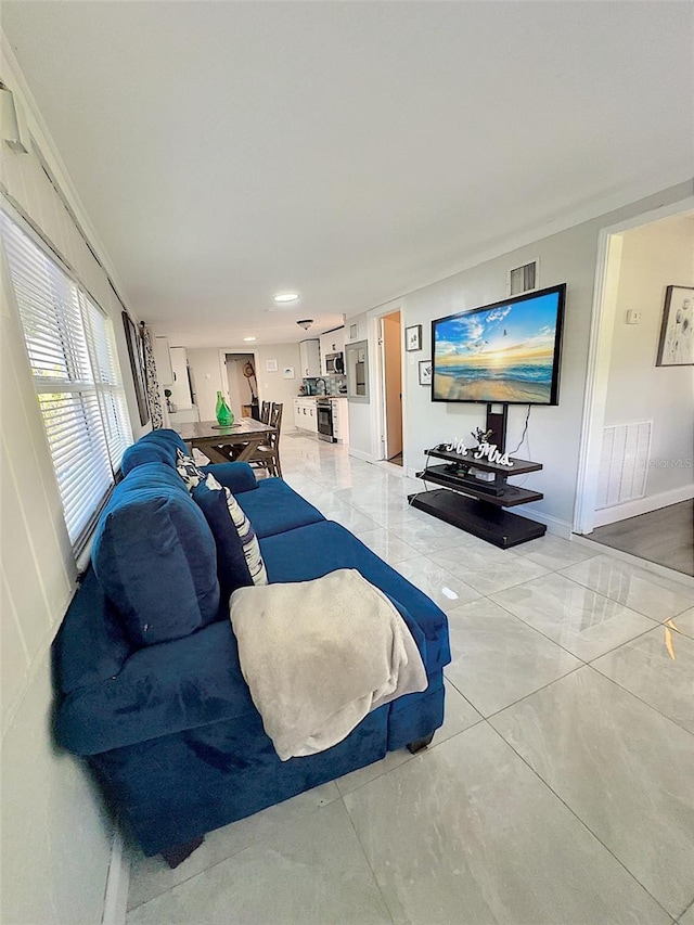 living room featuring crown molding