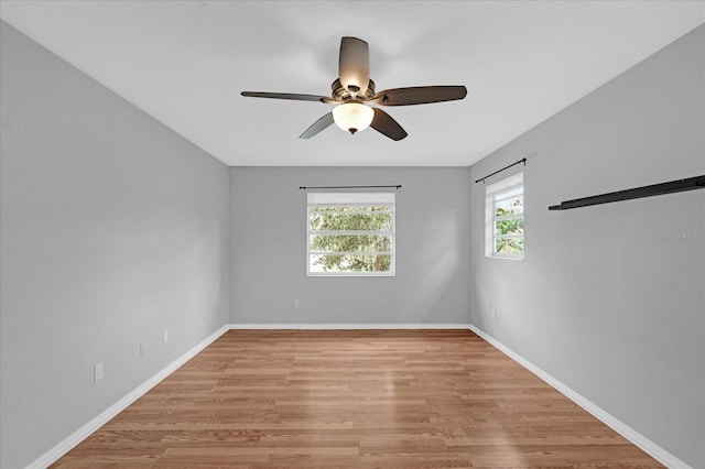 spare room featuring ceiling fan and light wood-type flooring