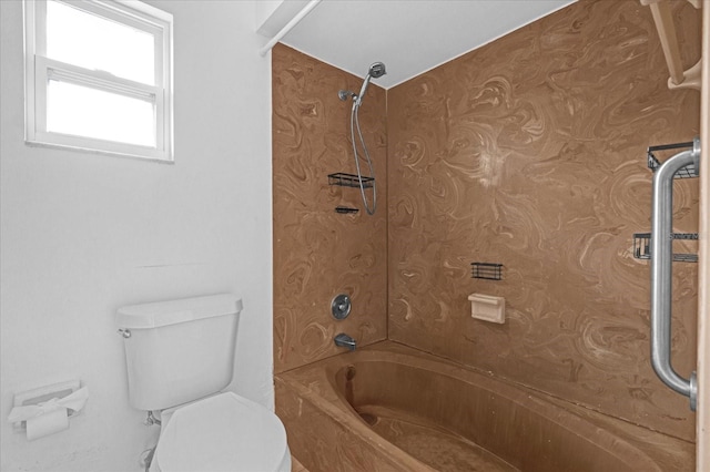 bathroom featuring toilet and bathing tub / shower combination