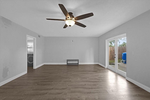 unfurnished living room featuring dark hardwood / wood-style flooring and ceiling fan