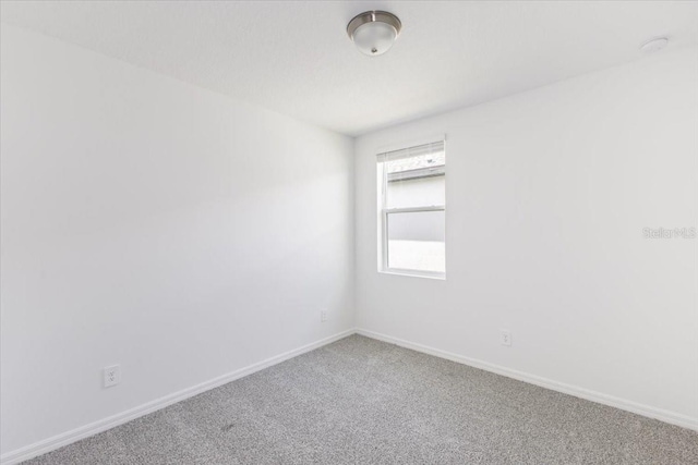 spare room featuring carpet flooring