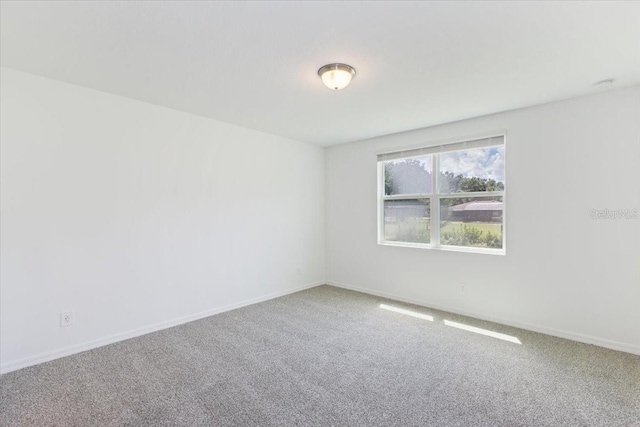 spare room featuring carpet flooring