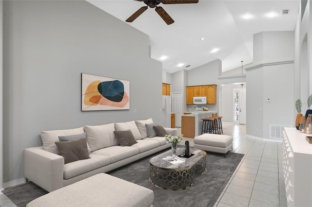 living room with high vaulted ceiling, ceiling fan, and light tile patterned flooring