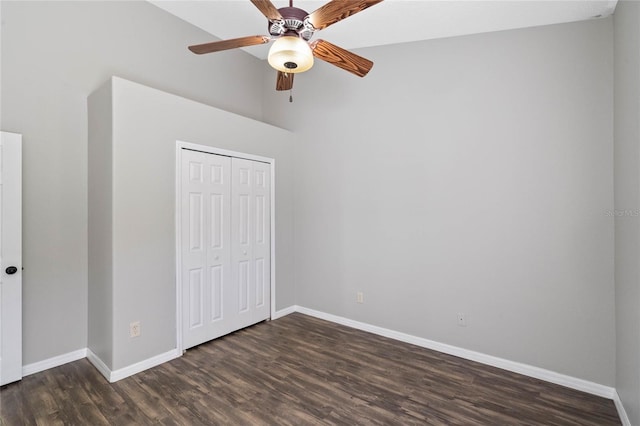 unfurnished bedroom featuring dark hardwood / wood-style flooring, a closet, and ceiling fan