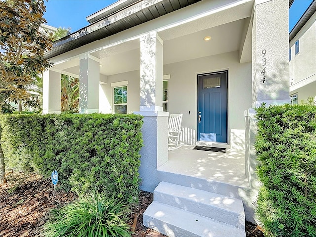 property entrance featuring covered porch