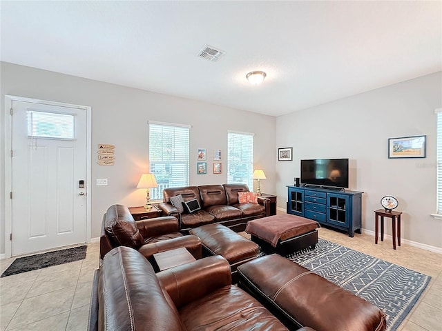 living room with light tile patterned flooring