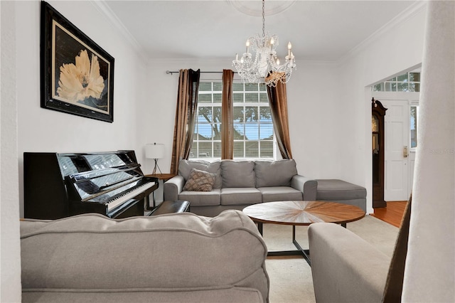 living room with a chandelier, light wood-type flooring, and ornamental molding