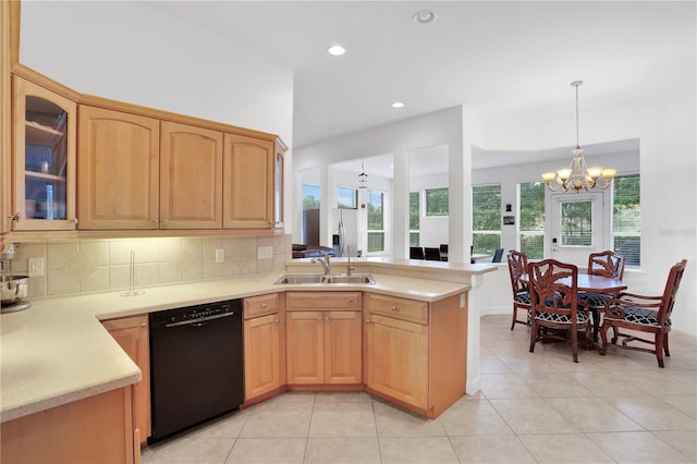 kitchen featuring sink, dishwasher, tasteful backsplash, a notable chandelier, and kitchen peninsula