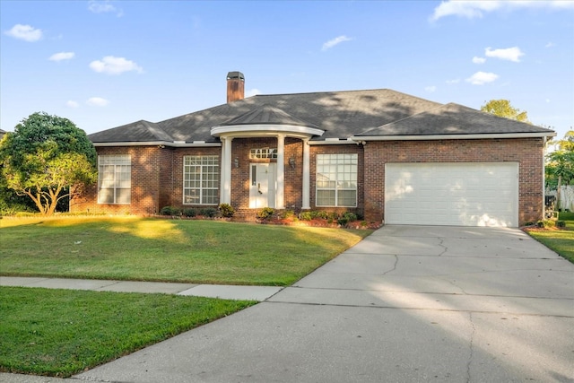 single story home featuring a garage and a front lawn