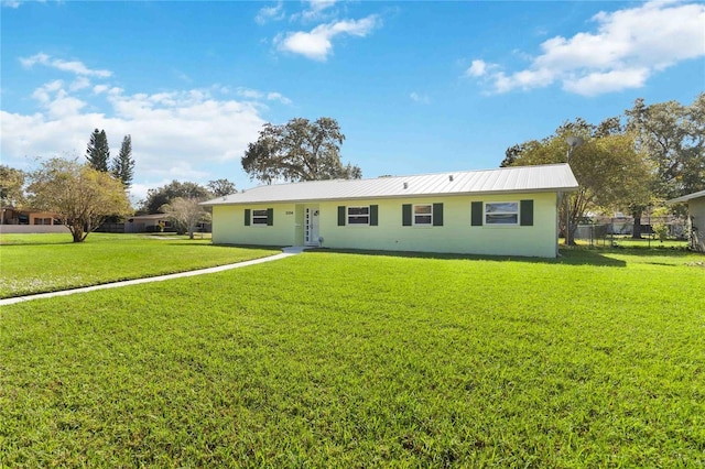 ranch-style home with a front yard