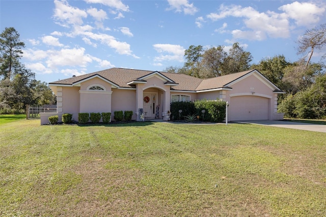 single story home with a garage and a front yard