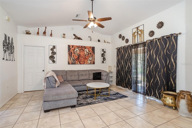 tiled living room featuring ceiling fan and lofted ceiling