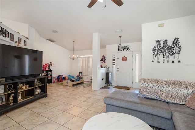 tiled living room with ceiling fan with notable chandelier