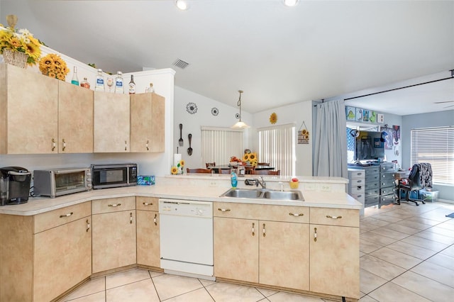 kitchen featuring lofted ceiling, white dishwasher, sink, decorative light fixtures, and kitchen peninsula