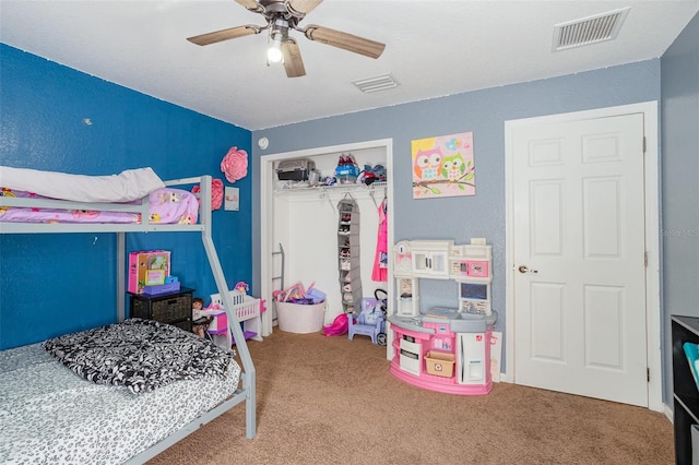 bedroom with ceiling fan, a closet, and carpet