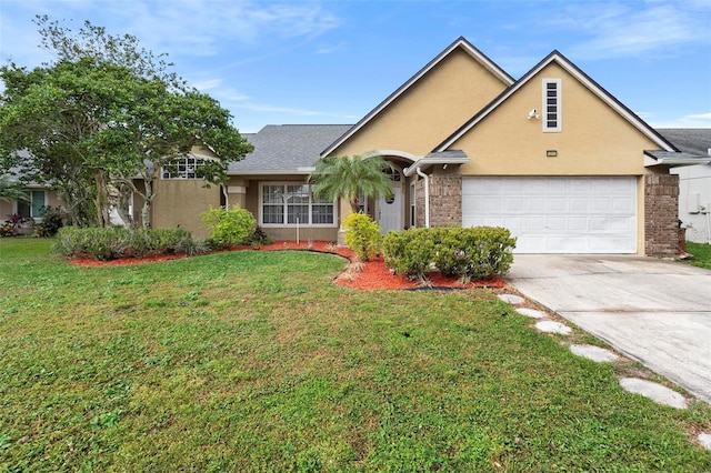 12512 Tillingham Ct SW, Orlando, FL 32837 - traditional-style home with stucco siding, concrete driveway, a front lawn, an attached garage, and brick siding