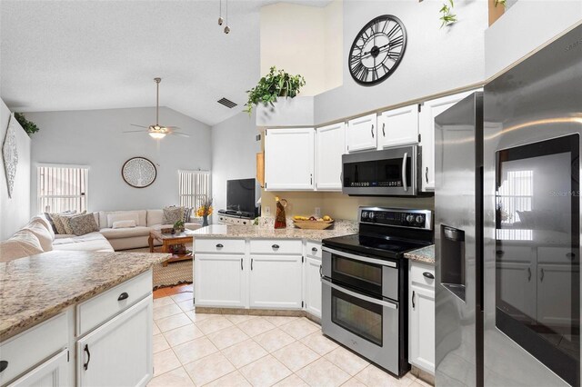 12512 Tillingham Ct SW, Orlando, FL 32837 - kitchen with stainless steel appliances, light tile patterned floors, a ceiling fan, a peninsula, and open floor plan