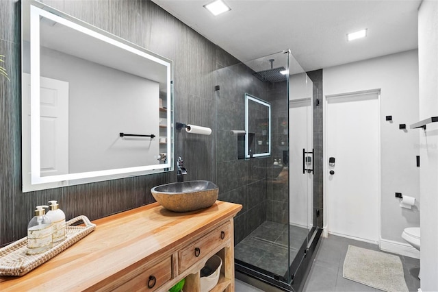 12512 Tillingham Ct SW, Orlando, FL 32837 - full bathroom with a stall shower, tile patterned flooring, vanity, and toilet