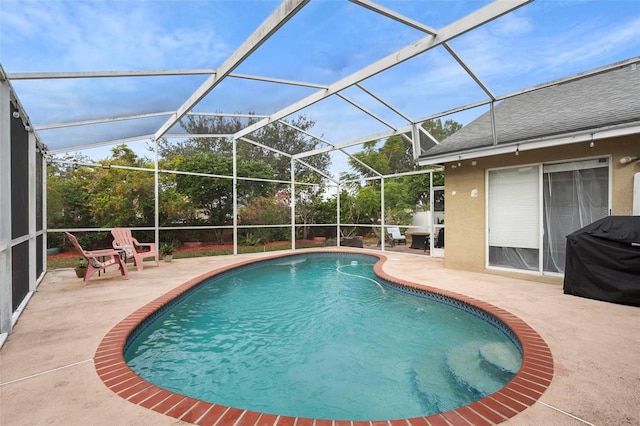 12512 Tillingham Ct SW, Orlando, FL 32837 - outdoor pool featuring a patio, glass enclosure, and area for grilling