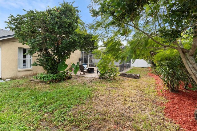 12512 Tillingham Ct SW, Orlando, FL 32837 - view of yard featuring a patio area