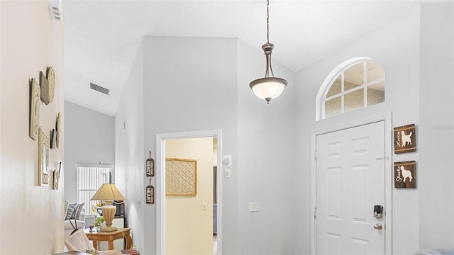 entryway with high vaulted ceiling