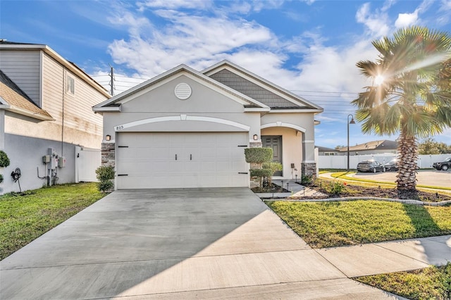 view of front of property with a garage and a front yard